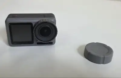 DJI Action 1 camera, used for a short while, works well without issues left top corner on the back h...