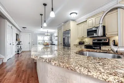 Luxury Townhouse, two level with a large fenced and green backyard on Vitalia Cr. from Washmill Lake...