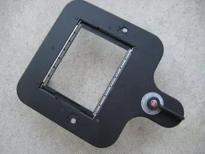 Timers,..Easels.. enlarger lenses, lens mounting cones for Omega enlargers. SS developing tanks and...