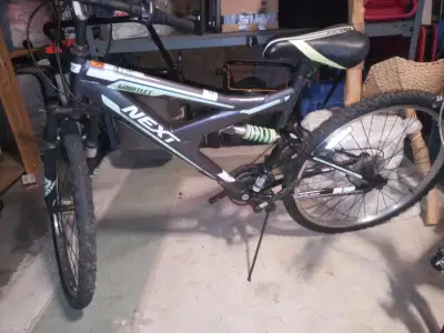 Next Gauntlet mountain bike for adults. 18 speed. 26" wheels. Large frame. Needs foot pedals. Gears...