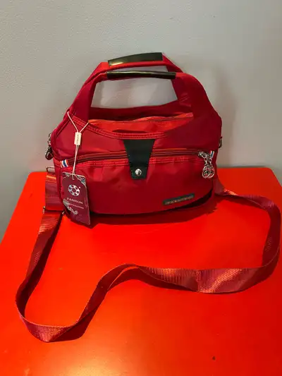 This anti-theft satchel tote bag is new with tags and is perfect for everyday use. It features a dur...