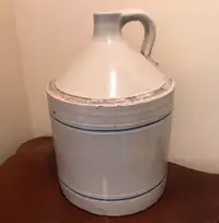 Glazed 2 gallon clay jug.