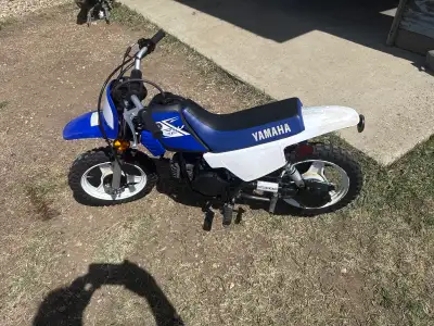 Bike runs as good as it looks, comes with helmet & some riding gear pictures of the sizes. Oil pump...