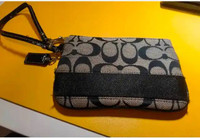 coach Small Wristlet and dinosaur keychain