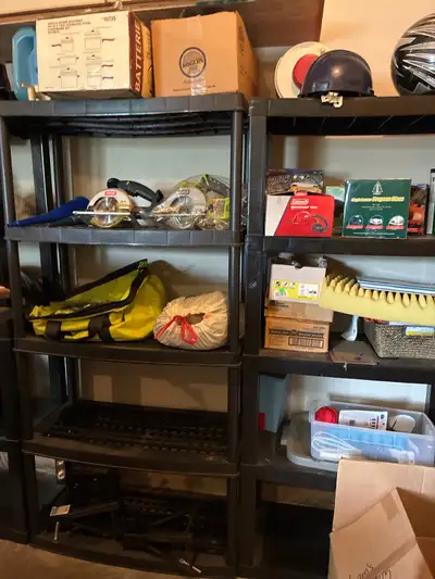 This sturdy, black plastic shelving unit is perfect for organizing your garage or basement and is in...