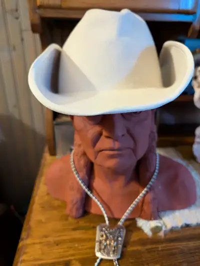 Get ready for the Calgary Stampede!! Felt hat 6 & 7/8 is size. Few spots(see photos) plus a bolo tie...