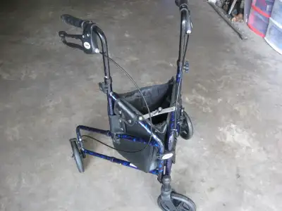 A Carex brand 3 wheel walker. Hand brakes. Adjustable handles for height. A pouch for carrying small...