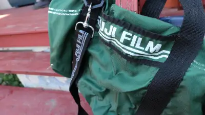 Fuji camera bag (Green) with multiple straps. Good Condition.