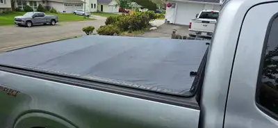 TonnoFold Premium Soft Tri-fold Tonneau Cover Fits 6.5' box Black textured finish is tear-resistant...