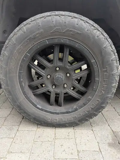 Wheels off Toyota Tundra. Tires getting low. Probably another summer left in them. Rims are in good...