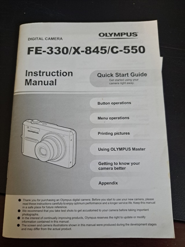 Olympus 8 megapixel camera, with batteries, 2gb XD card, manual