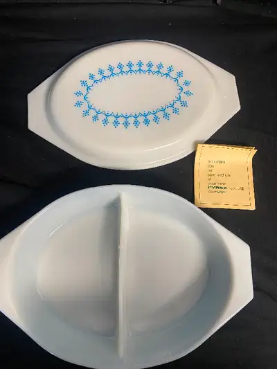 I am selling this Like New Pyrex 32oz. Oval Divided Serving Dish with the Snowflake Blue Design. It...