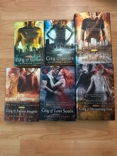 The Mortal Instruments Series by Cassandra Clare 1) City of Bones 2) City of Ashes 3) City of Glass...