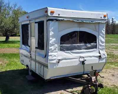 This shortened camper has had the ends removed because the screens and canvas on them had some tears...