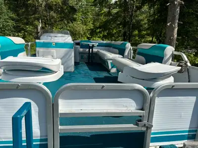 24ft Sweetwater made by Godfrey fc pontoon boat. 60hp Evinrude. Bunk style tandem axle trailer. Aski...