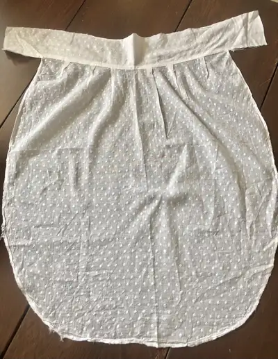 This piece looks like it was once part of an apron or front piece. It was stored as part of a large...