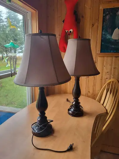 2 Electric brown wooden Lamps with sand colored shades. Excellent condition. 25" high with 11" high...
