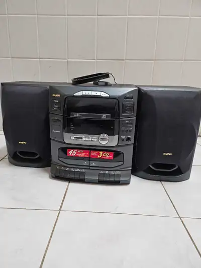 Listen to your favourite tunes on this vintage Sanyo stereo system, featuring a 3-CD changer, dual c...