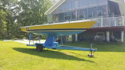 Soling Sailboat with trailer. Day Sailor - 27 feet long https://en.wikipedia.org/wiki/Soling Has 3 f...