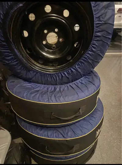 Good condition Michelin X-Ice Snow tires with rims. Tread depth is decent as shown with a quarter in...