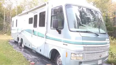 Washer and dryer in one. Tandem axels 1 with single tires and 1 with dual tires. Seller motivated.