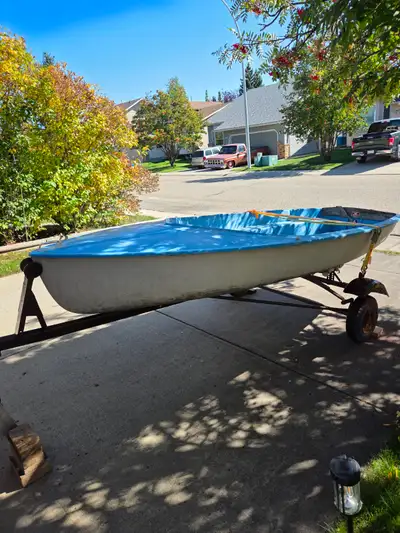 Kolibri 12 foot Sailboat and its trailer. Made by Glenmore Sailboats and is the type that was used f...
