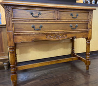 Luxurious wood console table with drawers