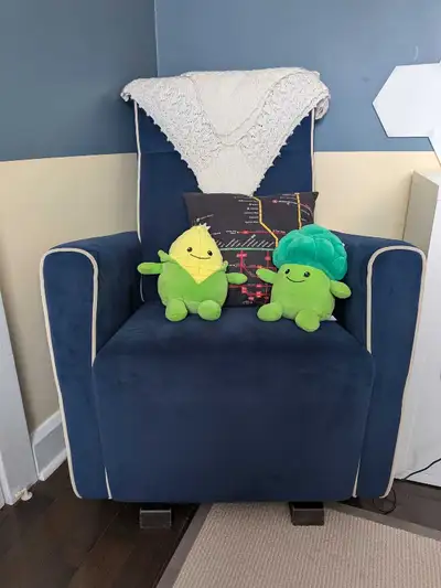 Dutailier gliding rocker, perfect for a nursery or cozy corner. This chair is in excellent condition...