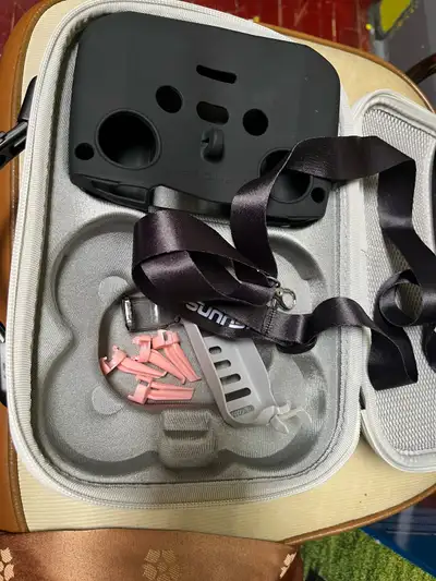 Includes a case and a few accessories. For only drone NEO White exterior, black handle. Inside conta...