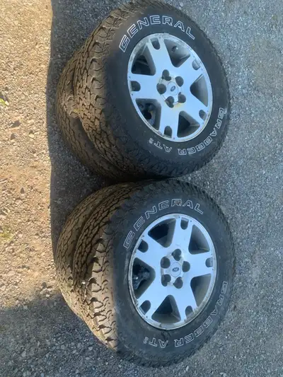 rims off 2003 ford escape with general grabber AT2 tires still lots of tread reason for selling no l...