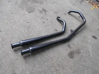 This exhaust in ceramic coated black. It will fit any Evolution motor mounted in a Softail or any ri...