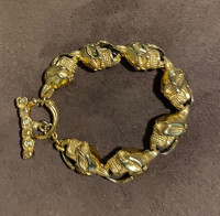 Gold coloured metal skull bracelet