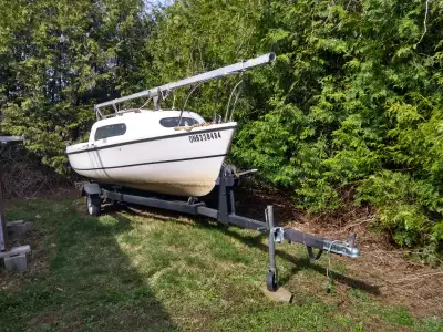 Siren 17 foot sailboat, cuddy cabin sleeps two or can be used for weatherproof storage. Everything h...