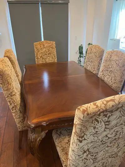 Custom made solid wood dining table that can be extended up to 10 seats as it has two extra slots wi...