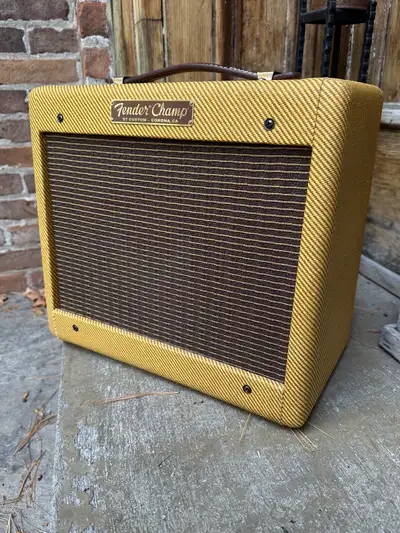 Fender Champ '57 Custom guitar amplifier with a cover. Corona, California