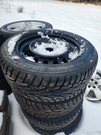 Like New 215/55/16 winter tires on 5x114.3 black steel rims