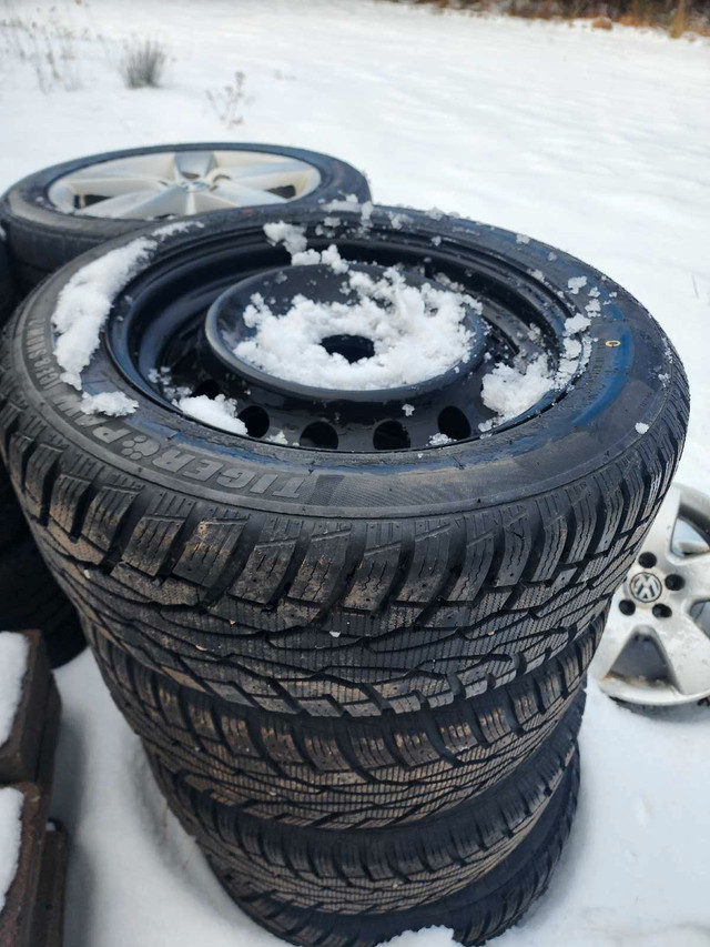 Like New 215/55/16 winter tires on 5x114.3 black steel rims in Tires & Rims in Cape Breton