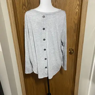 Buttons going down the back of the shirt, View more