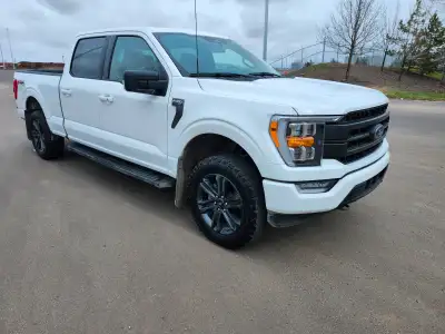 2023 Ford F150, crew cab, 3.5 L, low KM, 21 KM, blackout sport package, twin moon roof, heated seats...