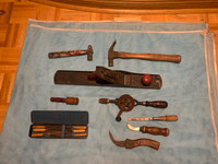 Antique woodworking tools and wrenches.