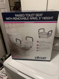 Raised toilet seat 