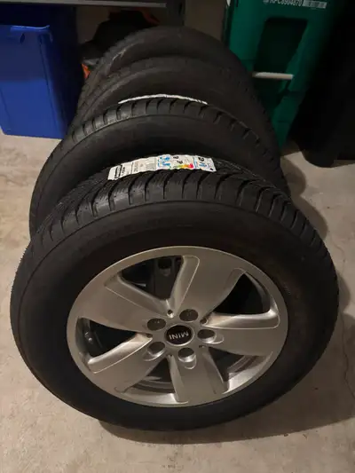 Get ready for winter with this set of four Bridgestone Blizzak LM001 winter tires, size 205/65 R16,...