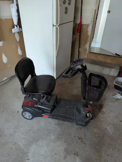 Drive brand mobility scooter. Used, dusty. Needs new battery but has charging cord.