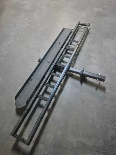 This sturdy hitch-mounted motorbike carrier is in good, used condition, providing a reliable and sec...