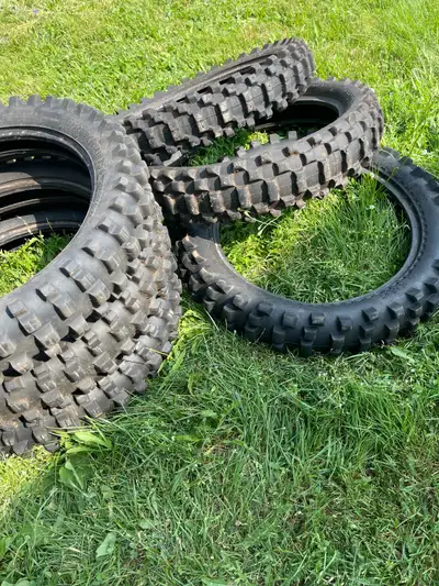 Assorted dirtbike tires by Michelin Pirelli ATC mitas 150 for all of them