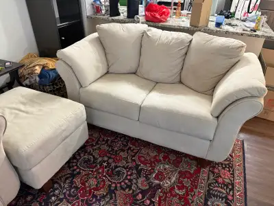 Brand new couch and barely used comes with side ottoman as well for a great living room combo perfec...
