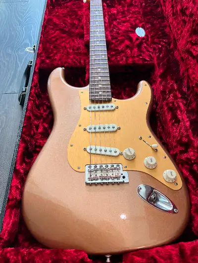 Mint condition Fender Custom Shop Postmodern Stratocaster finished in Fire Mist Gold with a "Lush" C...