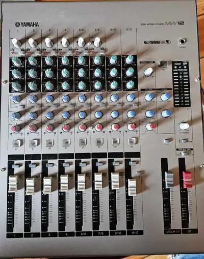 For sale is a Yamaha MM12 mixing console, offering versatile audio control for studio or live sound...
