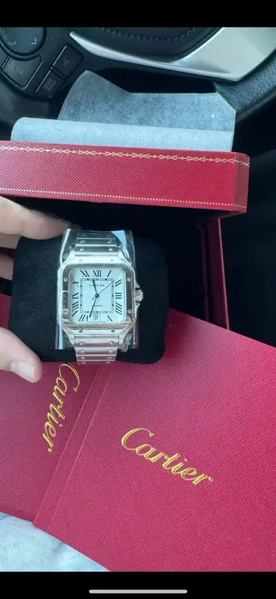 Brand new Cartier santos watch, complete set with Bag, Box, papers and receipt.