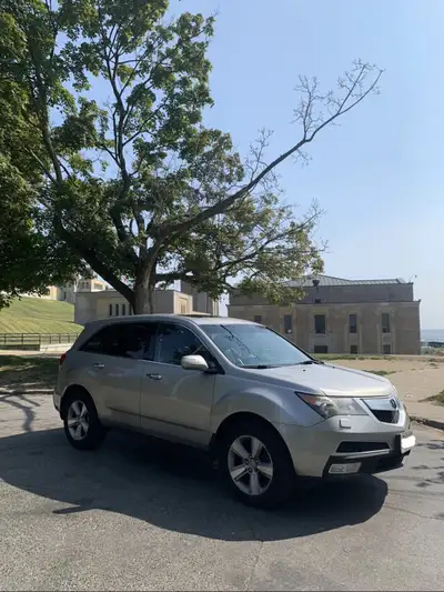 2012 Acura MDX silver Sunroof Backup camera Navigation system Rear entertainment system Please conta...